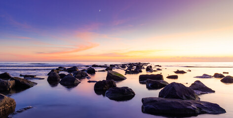 Beautiful Sunset over the Mediterranean Sea and its Rocks
