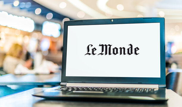 Laptop Computer Displaying Logo Of Le Monde