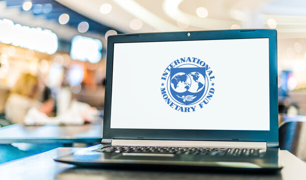  Laptop displaying logo of The International Monetary Fund (IMF)