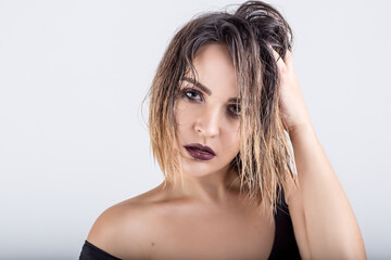Naklejka premium beautiful girl with wet hair on a white background