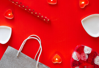 Top view - festive red background for Valentines Day. The concept of preparing for the holiday and wrapping gifts.