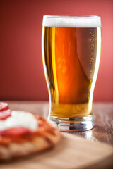Beer Pint with Salami Pizza. High quality photo.