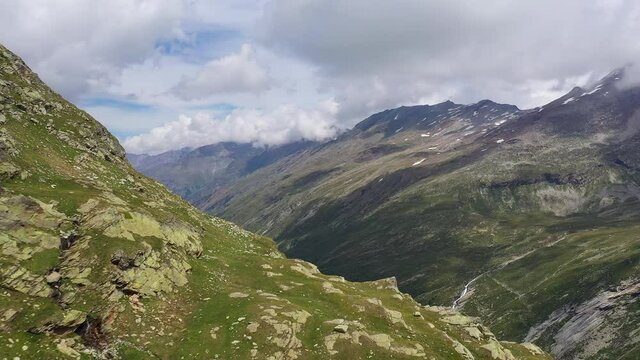 Aerial Footage With A Revealing Motion Of The Mattmark Lake And Dam Near Saas Fee In Canton Valais In The Alps In Switzerland