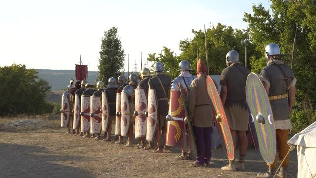 Roman legion military of ancient Rome. March of soldiers. Roman military personal equipment, military cadence. A reenactors dressed as a Roman soldier