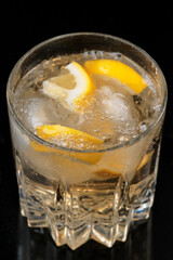 Lemonade drink with lemon and ice