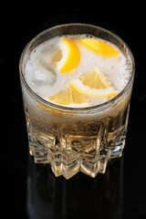 Lemonade drink with lemon and ice