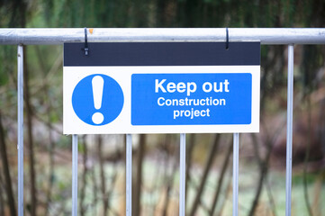 Fototapeta premium Construction site health and safety keep out sign on fence boundary