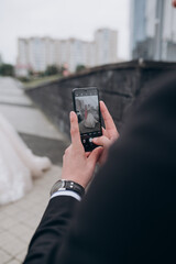 a man takes a photo on his phone