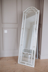 white mirror in a beige room