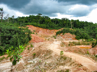 Rainforest destruction. Abandoned gold mining pit in Guyana, South America.