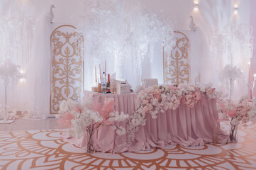 the table of the newlyweds decorated with flowers