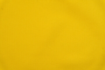 Bright yellow background made of textile material. Fabric with natural texture. Fabric isolated background.