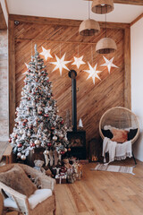 christmas tree, stove and chair at home