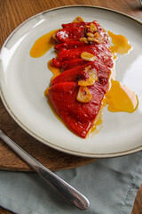 Spanish Piquillo peppers with garlic and olive oil. Spanish tapas dish. 