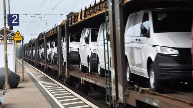 Freight Train Carrying brand new cars. Cars transported by railway from the factory