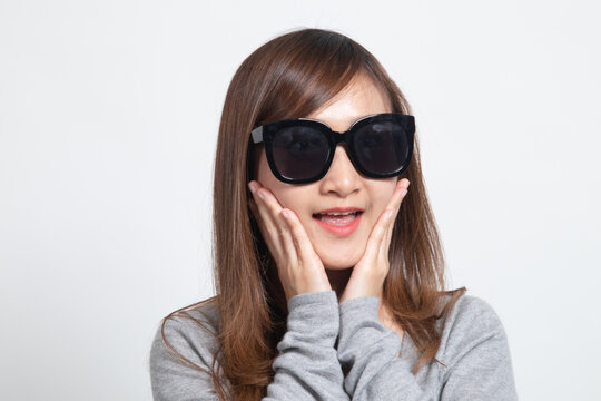 Portrait of a beautiful young asian girl in sunglasses.