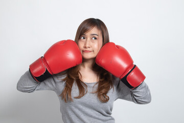 Young Asian woman with red boxing gloves.