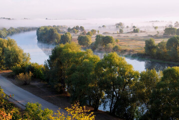 Fototapeta na wymiar View from the high right bank to the Desna River in the autumn morning