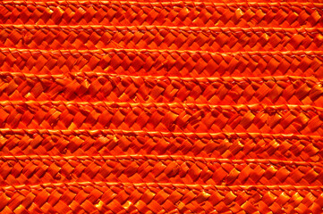 Rattan wicker texture with handmade traditional and dry branches, wicker orange texture background