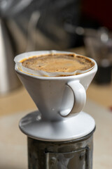 V6 with full cup of coffee