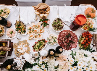 table set with various dishes and food in the restaurant