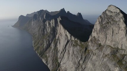  Incredible peak of Segla mountain diving into a beautiful Norwegian fjord. Lofoten Island