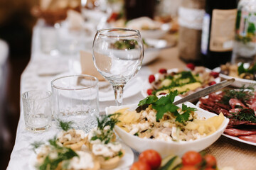 festive table in the restaurant with wine glasses