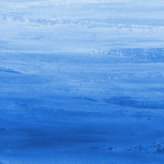 Blue ink and watercolor texture on white paper background. Gradient paint strokes and decalcomania effect. Hand-painted gouache abstract image. Mess on the canvas.