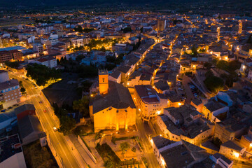 Aerial view of illuminated cityscape of Castalla in autumn evening, province of Alicante, Spain