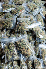 Vertical photo of some bags of medical marihuana prepared for consumption.