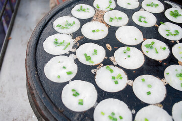 Kanom Krok, a traditional Thai dessert made from crushed coconut meat. - obrazy, fototapety, plakaty