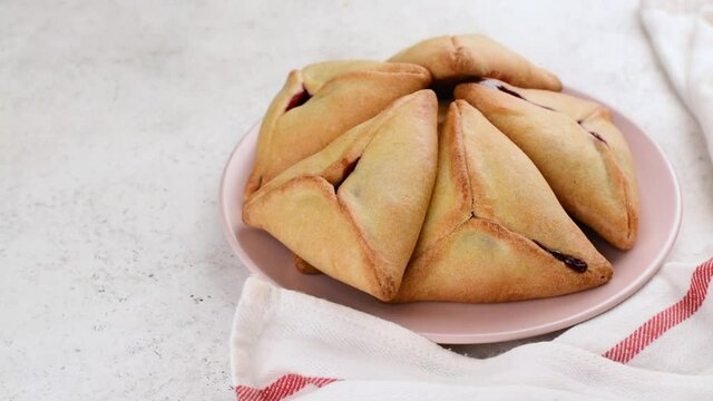 Traditional hamantaschen cookies with jam for Purim celebration
