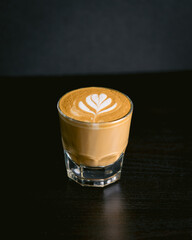 cortado latte on a table simple background