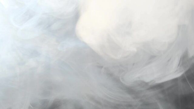 White smoke on black background in slow motion