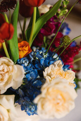 Blue white and red flowers. Wedding arrangement with flowers