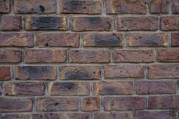 Brick texture.  Old red orange brown worn and weathered brick wall, clinker bricks.