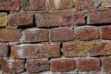 Brick texture.  Old red orange brown worn and weathered brick wall, clinker bricks.