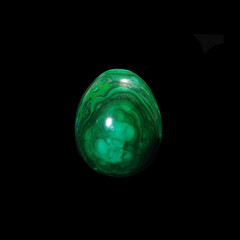 malachite egg on black background 