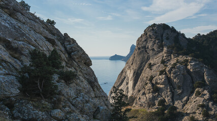 Fototapeta na wymiar Black sea view between two rocks in Sudak, Crimea