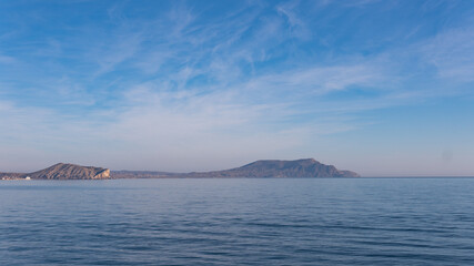 Naklejka na ściany i meble Landscape view on mountains and Black sea in Crimea, Sudak with colorful sky