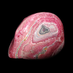 huge rhodochrosite stone on black background 