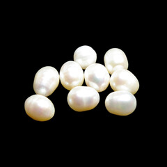 Crude pearls on black background 