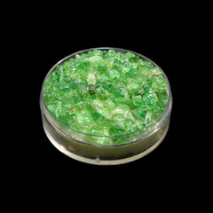 crude emeralds on black background 