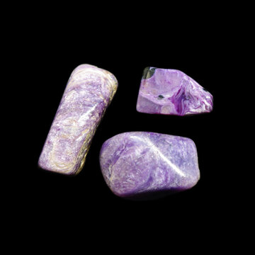 charoite stones on black background 