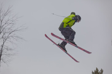 Shot of a snow skier during an impressive jump at the Maryland open freestyle competition