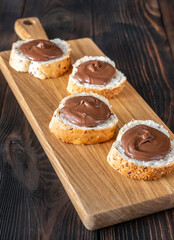 Slices of baguette with chocolate paste