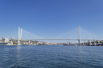 Fototapeta na wymiar sunny day view of Golden bridge in Vladivostok