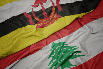 waving colorful flag of lebanon and national flag of brunei.