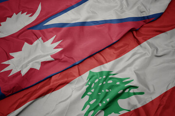 waving colorful flag of lebanon and national flag of nepal.