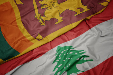 waving colorful flag of lebanon and national flag of sri lanka.